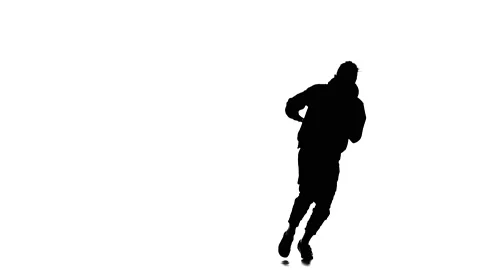 Young guy dancing hip hop, freestyle, street dance, slow motion, silhouette Stock Footage 130335545