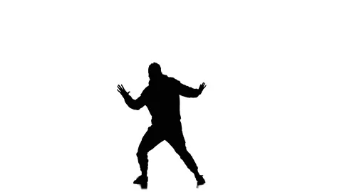Young guy dancing hip hop, freestyle, street dance, slow motion, silhouette Stock Footage 130335658