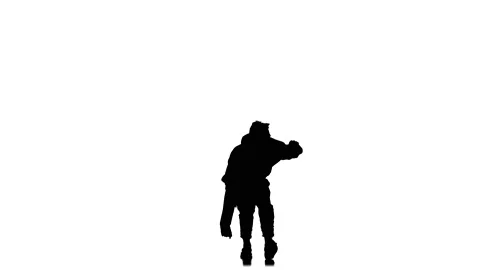 Young guy dancing hip hop, freestyle, street dance, slow motion, silhouette Stock Footage 130335796