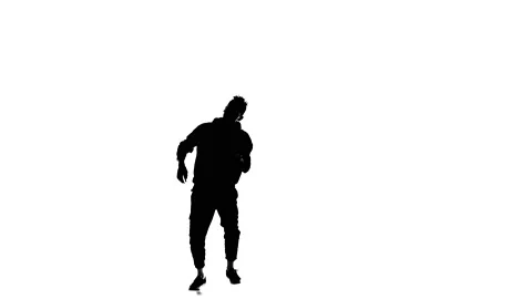 Young guy dancing hip hop, freestyle, street dance, slow motion, silhouette Stock Footage 130335801