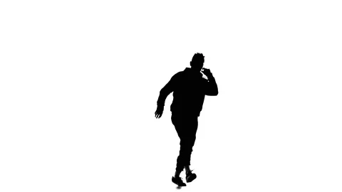 Young guy dancing hip hop, freestyle, street dance, slow motion, silhouette Stock Footage 130335898
