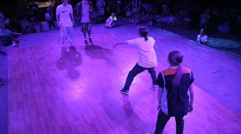 Young Guy is Dancing popping during Dance Battles on the dance floor Stock Footage 59895115