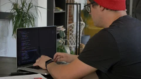 Young guy developer working with computer at home office 動画素材 162194564