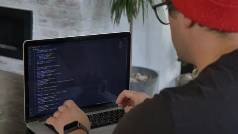 Young guy developer working with computer at home office Stock Footage 162194572