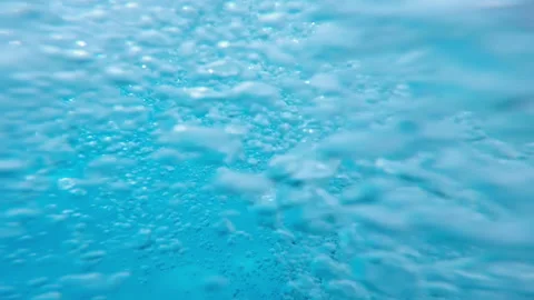 Young guy dives under the water in the aquapark and emerges 스톡 동영상 102089717