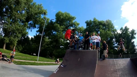 A young guy does tricks on a bicycle at a skatepark in Sumy, Ukraine Stock Footage 276904985