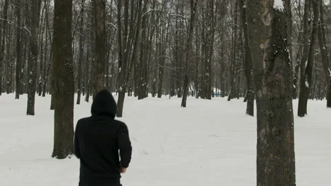 Young guy doing a run in the winter forest Stock Footage 111151781