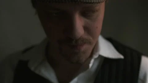 Young guy drinks whiskey, dressed in a retro style Stock Footage 162913409