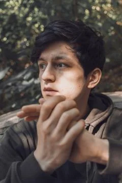 A young guy of Eastern appearance with black hair and a handsome expressive face 스톡 사진