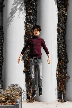 A young guy of Eastern appearance with black hair and a handsome expressive face Stock Photos