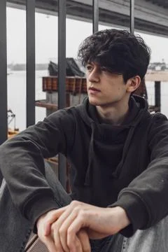 A young guy of Eastern appearance with black hair and a handsome expressive face 스톡 사진