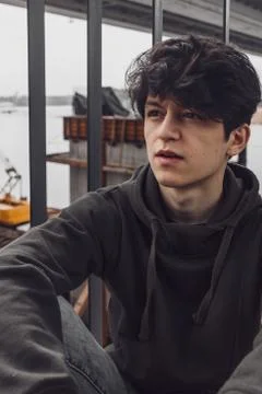 A young guy of Eastern appearance with black hair and a handsome expressive face 스톡 사진