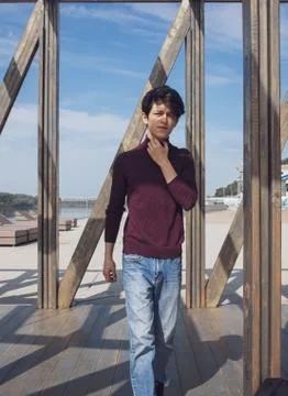 A young guy of Eastern appearance with black hair and a handsome expressive face 库存照片