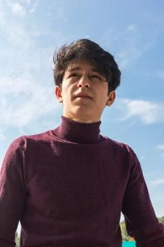 A young guy of Eastern appearance with black hair and a handsome expressive face 스톡 사진