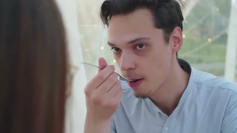 A young guy eats pineapple Stock Footage 154412215