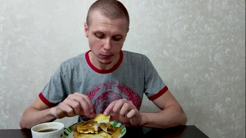 Young guy eats toast Stock Footage 197791728