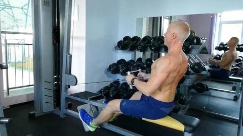 Young guy is engaged in a gym. Stock Footage 98054744