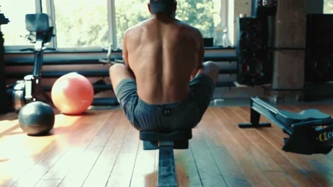 Young guy engaged in the rowing simulator Video stock 135569734