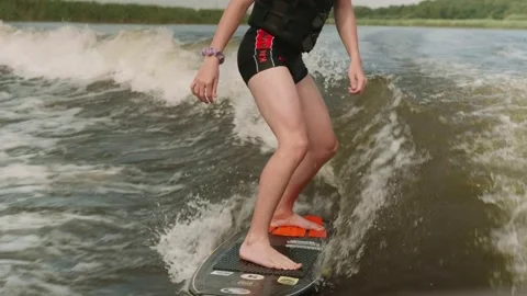 Young guy is engaged in wake surfing Stock Footage 158792927