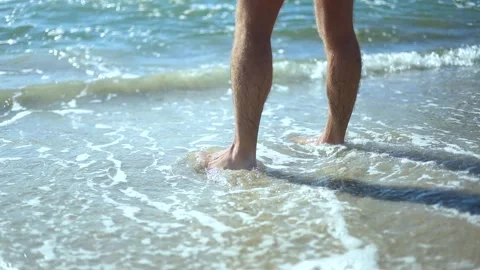 A young guy enjoys the sea Stock Footage 317459784