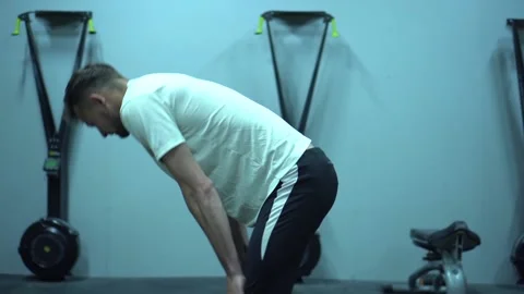 A young guy is exercising in the gym Video stock 131027528