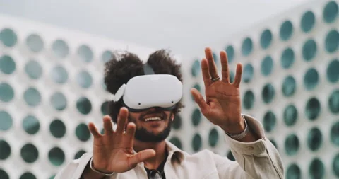 A young guy experimenting the new vr goggles Stock Footage 201134385