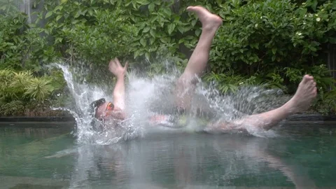Young guy falls into the pool and screams in Ubud. Stock Footage 104061184