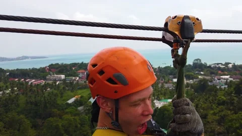 Young guy flies over the abyss 4K Stock Footage 232285446