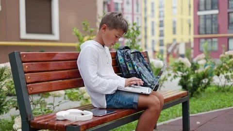 Young Guy Gamer Outside Playing Online game on Computer. Stock Footage 249823984