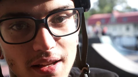 Young guy with glasses looks into the camera and then screams and laughs 스톡 동영상 103649753