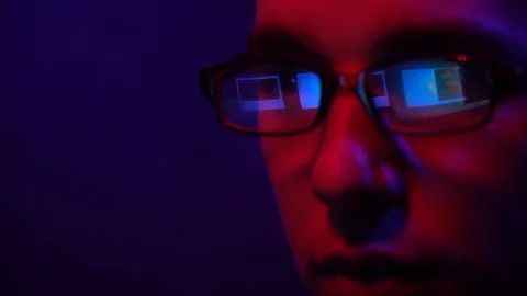 Young guy in glasses works at the computer Stock Footage 124360780