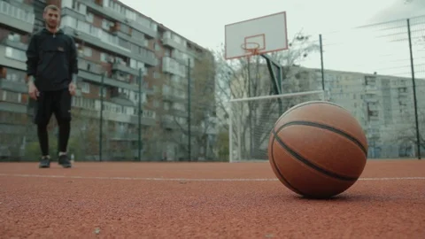 Young guy grabbing the ball, running with him to the basketball hoop and missing Video stock 106234641