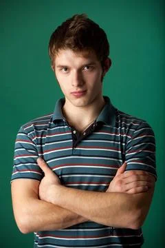 Young guy on a green background 스톡 사진