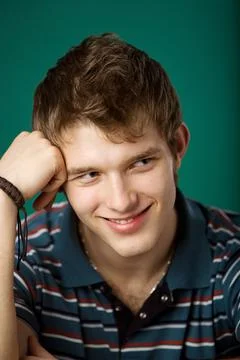 Young guy on a green background Foto stock