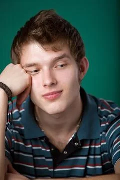 Young guy on a green background Stock-Fotos