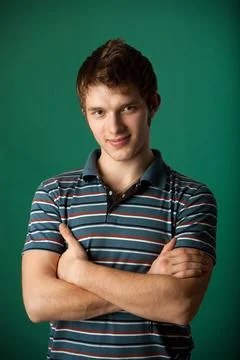 Young guy on a green background 스톡 사진