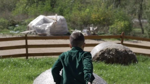Young guy guy jumps on haymouth Stock Footage 122646341