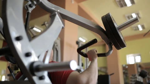 Young guy in a gym doing different exercises Stock Footage 60420084
