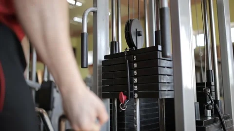 Young guy in a gym doing different exercises Stock Footage 60420123
