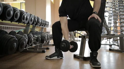 Young guy in a gym doing different exercises Stock Footage 60420205