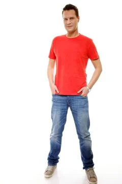 Young guy with hands in pockets isolated Stock Photos