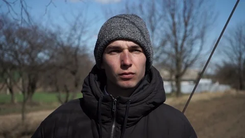 Young guy in a hat. Serious look.Portrait shooting Stock Footage 126358904
