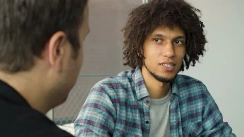 Young guy having a conversation in the office Stock Footage 144991957