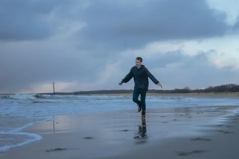 Young guy is having fun by the sea Stock Photos