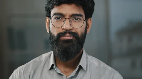 Young guy hispanic handsome bearded man smiling looking at camera male portrait Stock Footage 195256873