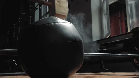 Young guy hit the ball with a sledgehammer Video stock 135569769