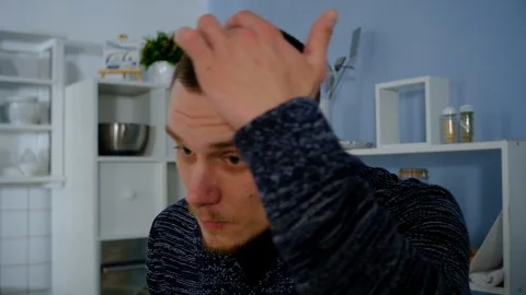 Young guy hit with a spoon Stock Footage 127258397