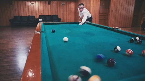 Young guy hits the balls and throws a cue Stock Footage 81476572