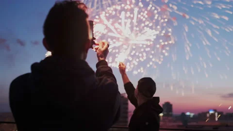 Young guy is holding a smartphone with sparklIng light and recording a video of Stock Footage 109090455