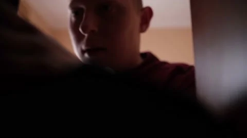 A young guy in a hurry collects things because of the hostilities Stock Footage 170875365